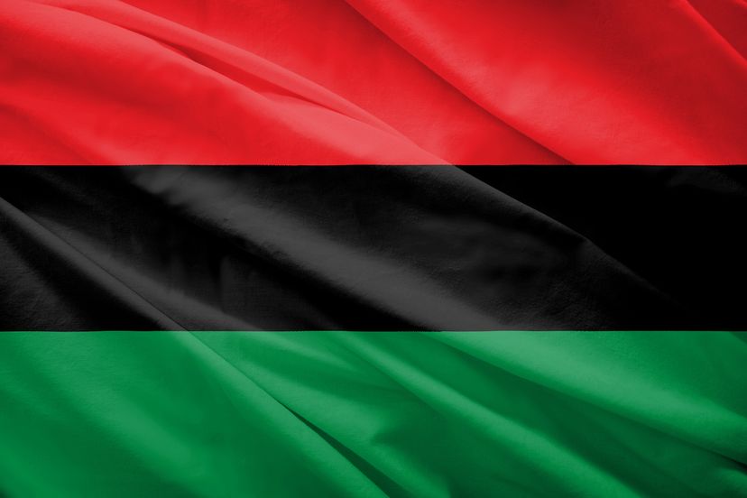 Waving flag with 3 horizontal stripes: red, black, and green