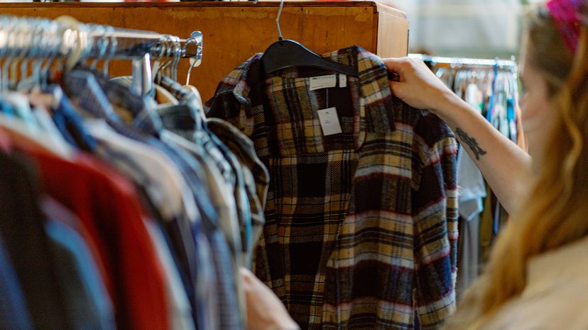 Young woman shopping in a thrift store