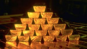 Gold bars stacked in a pyramid formation