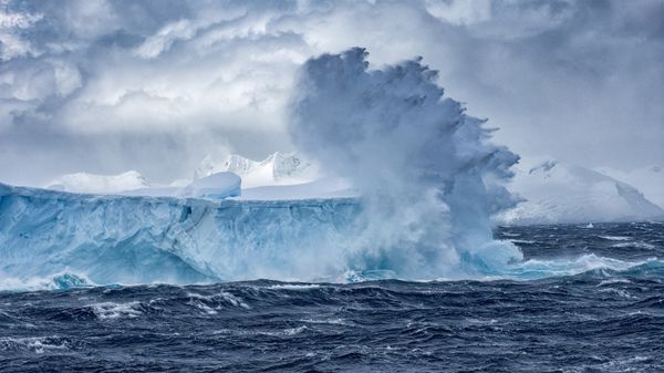 Massive Iceberg floating in the Southern Ocean in Antarctica with stormy seas