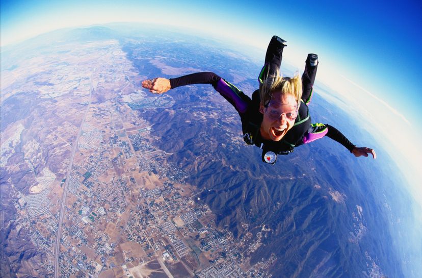 Woman skydiving, aerial view