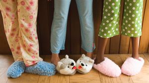 legs of three girls wearing pj pants and slippers