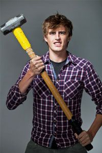 young man holding sledgehammer