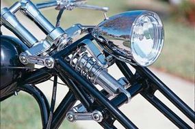 Stretched girder forks give this chopper its name,pivoting up and down on short arms to compressa coil-over shock mounted behind the headlight.