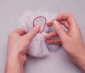 Sew hair band to center of netting.