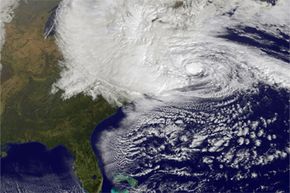In this NASA satellite image, Hurricane Sandy churns off the East Coast on Oct. 29, 2012, in the Atlantic Ocean. No doubt the hurricane that made landfall as a cyclone left immense destruction in its wake, but was it related to global warming? See more pictures of Hurricane Sandy.