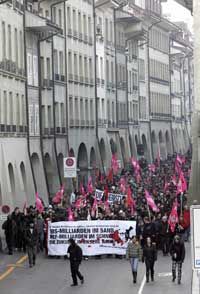 Anti-globalization protestors march through the Swiss town of Bern.