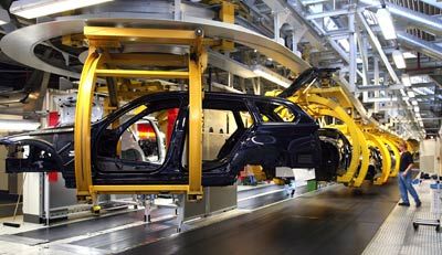 Workers construct BMW 3 series cars in the Munich BMW plant in Munich, Germany.