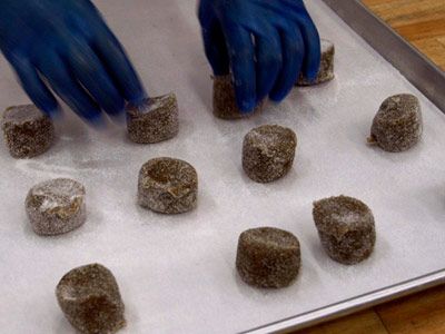 A baker prepares gluten-free molasses-ginger cookies.