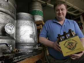 Brewer Craig Belser displays his gluten-free beer.