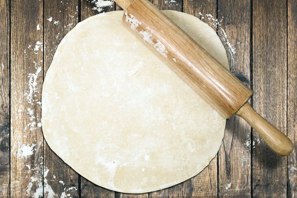 A rolling pin with dough.