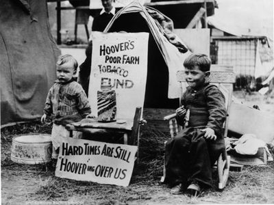 Children in poverty outdoors, black and white.