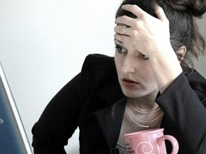 stressed woman at a computer