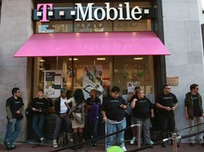 Customers wait in line to purchase a new HTC G1 at a T-Mobile store in San Francisco.