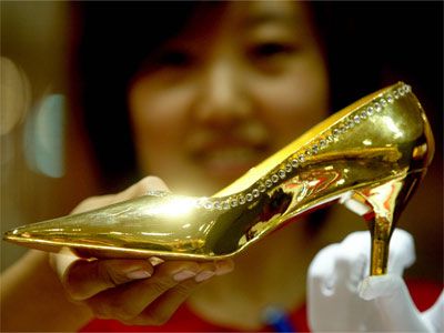 Gleaming gold-hued shoes for adult women.