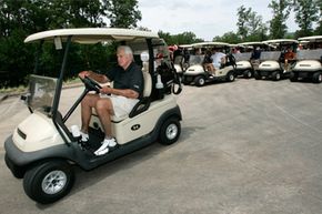 Veteran sportscaster Pat Summerall drives a golf cart before playing in the celebrity match that bears his name at Chenal Country Club in Little Rock, Ark.
