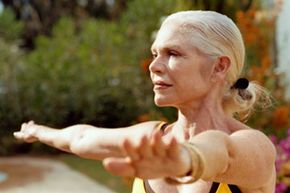 Senior woman doing yoga outdoors