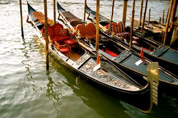 Traveling tourists explore the nautical vessel on the canal.