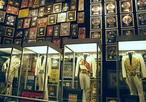 Elvis' famous jumpsuits and gold records are on display in the racquetball building.