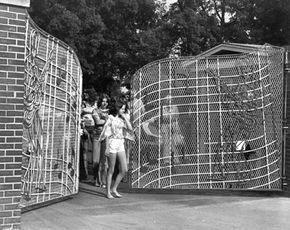 Fans leave the famous front gates of Graceland in the 1960s.