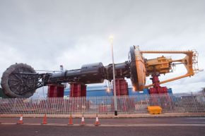 A PB150 PowerBuoy wave energy device waits on the dockside in Invergordon, Cromarty Firth Scotland.
