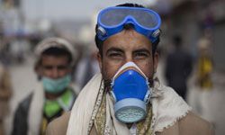 Yemenis protesters strap on respirators and goggles for a 2011 antigovernment protest.
