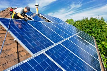 Man installing solar panels