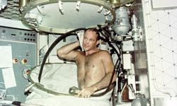 Skylab 3 pilot Jack R. Lousma takes a hot bath. This water would need to be recycled for further use to conserve resources and storage space.