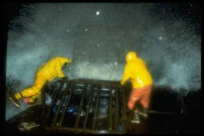 Crab fishermen who haul in pots face furious and frigid waves.