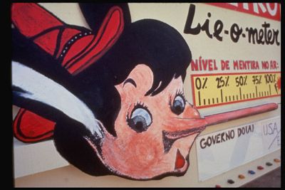 A Brazilian environmental group protests alleged greenwashing with a Pinocchio Lie-O-Meter. 