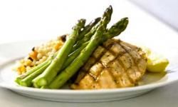 Chicken, asparegus and rice pilaf on plate