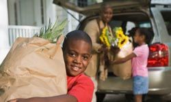 boy with groceries