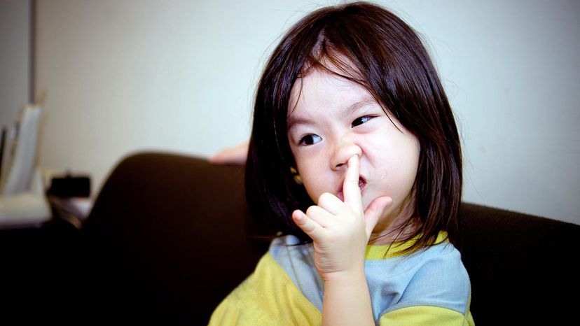 girl picking her nose