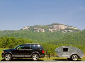 A Teardrop trailer behind an SUV