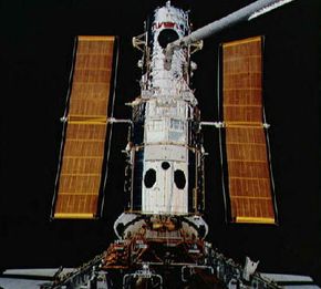 The Hubble Space Telescope is deployed from the cargo bay of the space shuttle. To learn more about Hubble, visit the Discovery Channel. See more Hubble Space Telescope pictures.