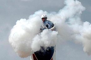 close-up of human cannonball being shot out of cannon