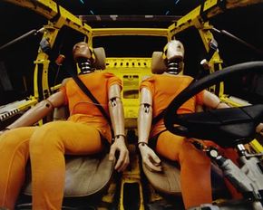 Two crash test dummies in a test vehicle