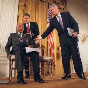 President Clinton and Vice President Al Gore recognize Herman Shaw, 94, a Tuskegee Syphilis Study victim, during a news conference in 1997.