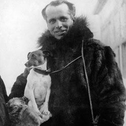 Italian solider and explorer Umberto Nobile holds his pet fox terrier
