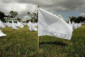 Naming a hurricane isn't all that difficult, but naming the dead in the aftermath of a hurricane obviously is. Pictured is one of 1,464 white flags bearing the names of people who died in Louisiana as a result of Hurricane Katrina.
