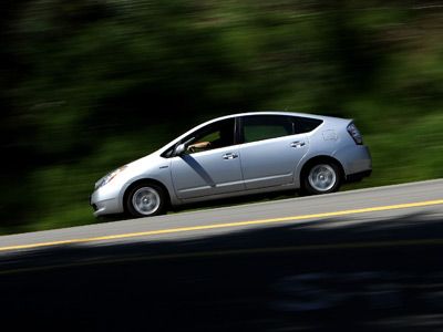 For some people buying a new hybrid car, like the Toyota Prius above, it's possible to get a tax credit that's as much as $3,400. But there are some important catches and scheduling issues of which to be aware.