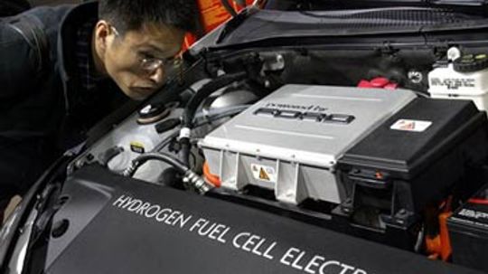 How do hybrid car designs aid in fuel efficiency?