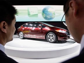 Visitors look at the Honda FCX Clarity at the Auto China 2008 auto show in Beijing, on April 20, 2008.