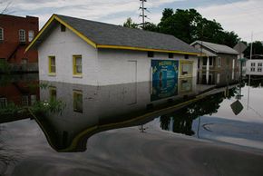 A business is surrounded by flood water from the Mississippi River in Foley, Mo.