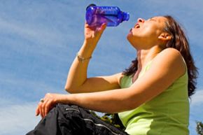 hiker drinks some water