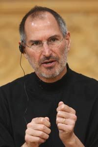 steve jobs holding apple