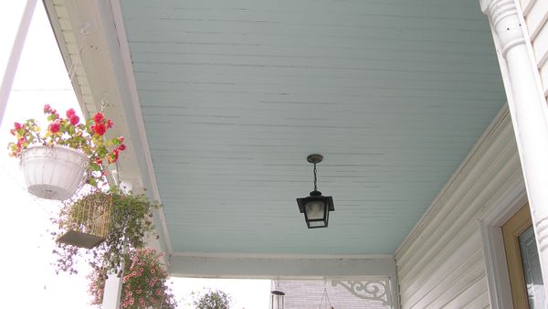 Decorative electric lanterns light the windowed architecture.