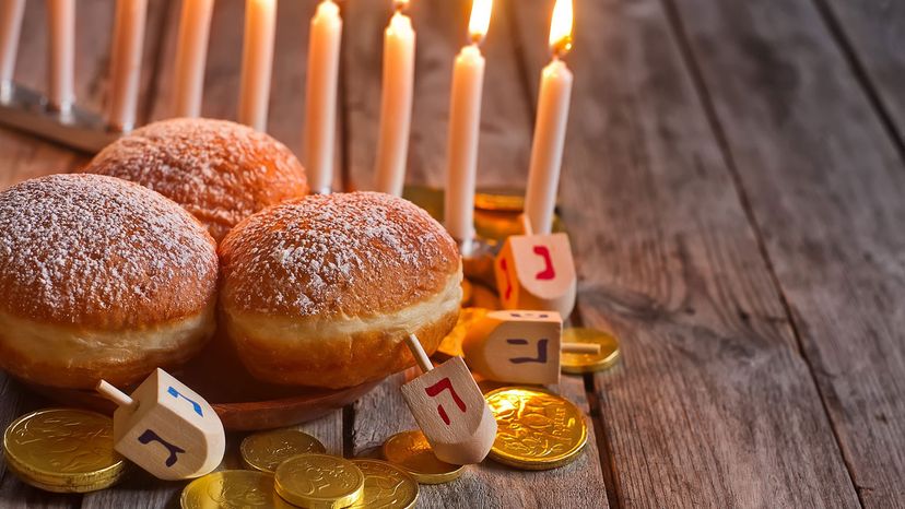 hanukkiah, doughnuts and dreidels