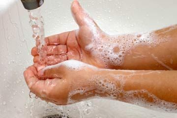 Child washing hands.