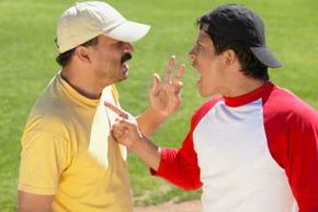 Two people arguing on field